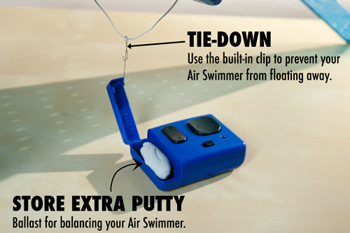 The remote control holds extra ballast and can be used to tie down the Air Swimmer and prevent it from floating away.