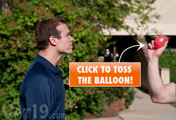 Man getting hit in the face with a water balloon.