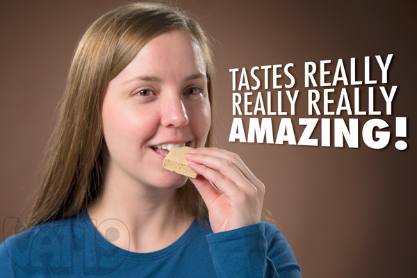Woman enjoying a delicious Caffeinated Marshmallow square.