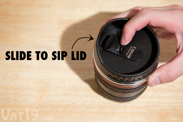 Thumb slider sip cover on the Camera Lens Mug.