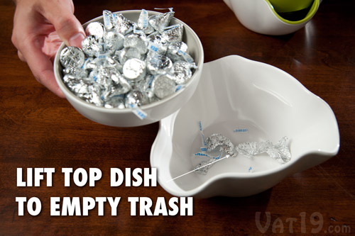 Simply lift the top dish to empty the trash of the Double Dish Snack Bowl.