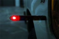 Flameless safety road flare features a magnetic bottom.