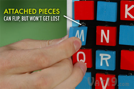 The tiles of the Hangman Travel Game are affixed with elastic, so they can be flipped, but not removed or lost.