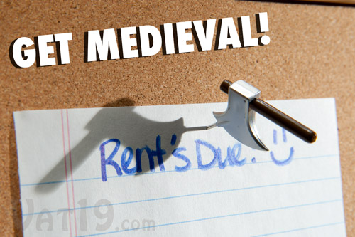 Medieval Weapons Pushpins Axe holding up a note.