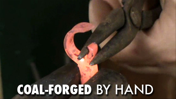 The Mine Train Spike Bottle Opener is coal-forged by hand.