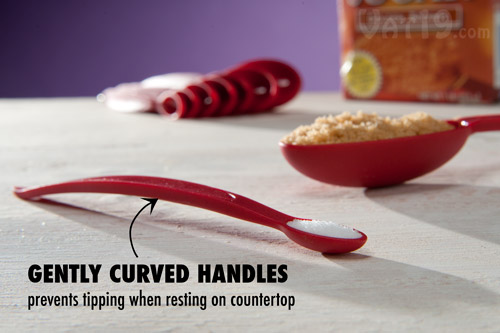 The curved handles of the Cuisipro Odd Size Measuring Scoops help them stay put when sitting on a countertop.