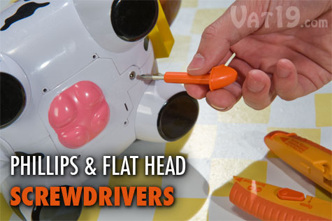 Remove the cap on the handle of the OpenIt! Plastic Package Opener to reveal a double-sided screwdriver for opening battery compartments.