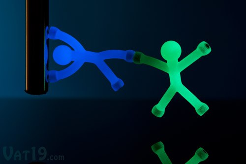 Glow in the Dark Q-Men are available in blue and green.
