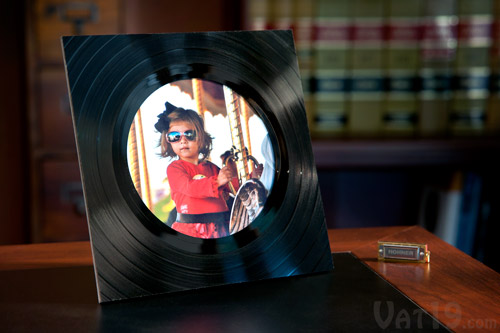 Beautiful vinyl record picture frame on a desk.
