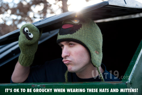 Sesame Street Oscar the Grouch Hats and Mittens in a dumpster.