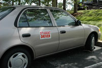 Side panel magnetic student driver sign