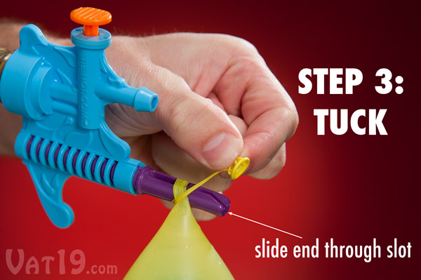 Step 3: Thread the end of the balloon through the tip of the tying tool.