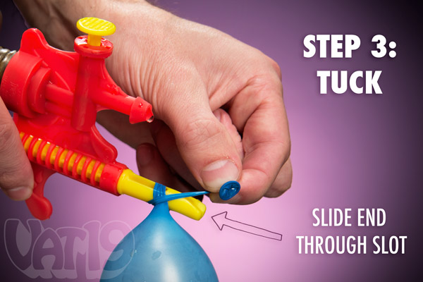Step 3: Thread the end of the balloon through the tip of the tying tool.