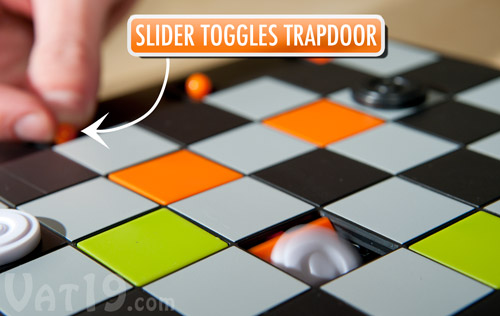 Push the trapdoor slider to activate one of eight trap doors.