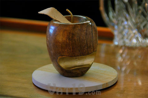 Instead of a hidden in a drawer, display this Wooden Apple Bottle Opener with pride